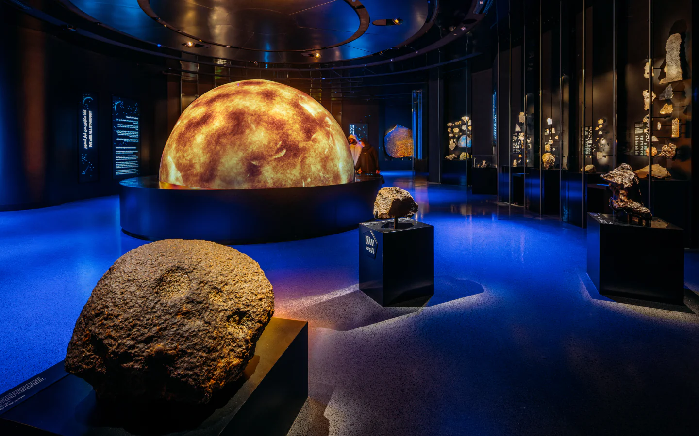 Illuminated Sun model and meteorite displays in the Story of Earth gallery 